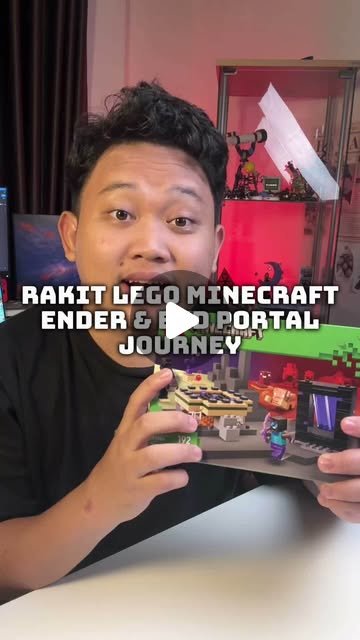 Adit holding the LEGO Minecraft Ender and End Portal Journey box at his build desk