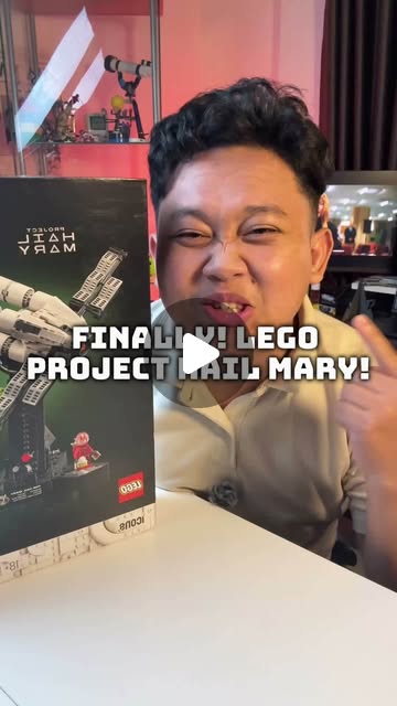 Adit reacting excitedly while holding the LEGO Project Hail Mary box